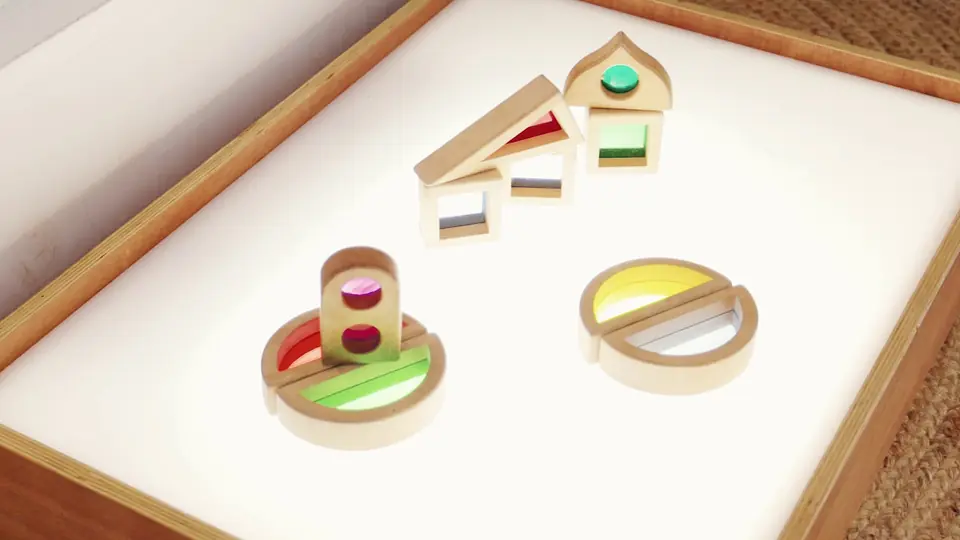Coloured wooden blocks lit from below on a light table.