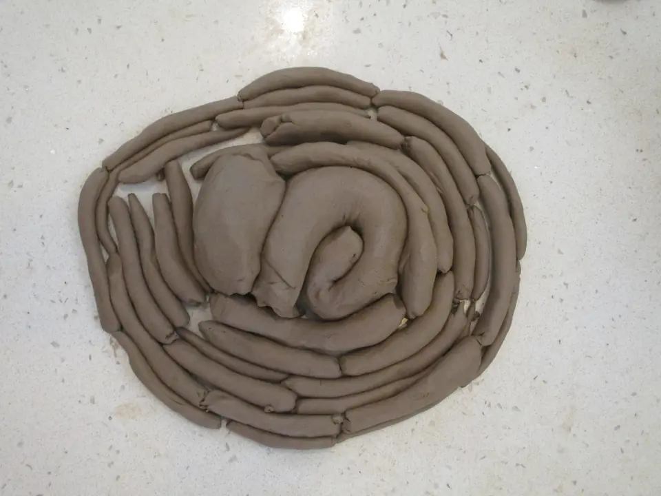 A spiral coiled from clay.