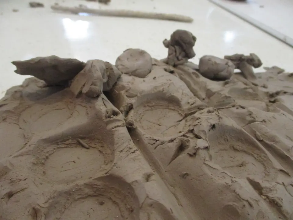 A clay landscape with small clay figures.